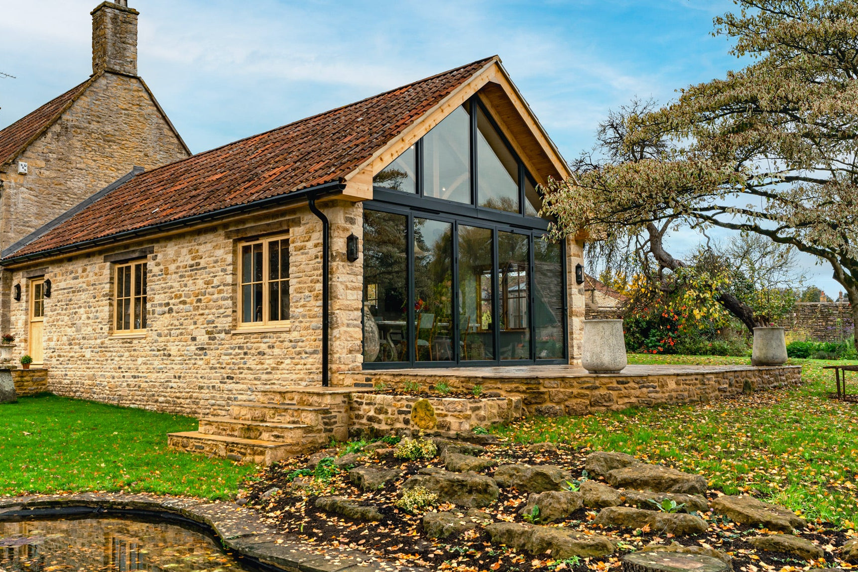 Cottage with modern extension in a garden setting